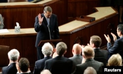 Outgoing House Speaker John Boehner departs the podium during a standing ovation after he addressed colleagues during the election for the new Speaker of the U.S. House of Representatives in the House Chamber in Washington, Oct. 29, 2015.