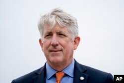 FILE - Virginia Attorney General Mark Herring attends a news conference near the White House, Feb. 26, 2018.