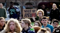 Students look on during a walkout from classes to protest the election of Donald Trump as president, Nov. 14, 2016, in Seattle, Washington. 