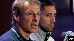 United States World Cup soccer team coach Jurgen Klinsmann, left, and team captain Clint Dempsey answer questions from the news media.