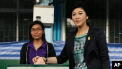 Thai Prime Minister and Pheu Thai party leader Yingluck Shinawatra poses before casting her ballot in the general election at a polling station in Bangkok, Thailand, Feb. 2, 2014.