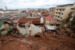 A destroyed house is covered by mud from a landslide caused by tropical storm Ana in Antananarivo, Madagascar, Jan. 26, 2022.