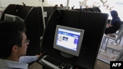 An Iranian youth browses a political blog at an internet cafe. The Iranian government has blocked the Iranian people from accessing thousands of websites.