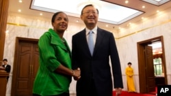U.S. National Security Adviser Susan Rice, left, greets Chinese State Councilor Yang Jiechi at the Diaoyutai State Guesthouse in Beijing, China, Aug. 28, 2015.