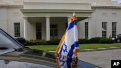 FILE - An Israeli flag is seen on one of the vehicles in Israeli Prime Minister Benjamin Netanyahu's motorcade during one of his meetings with President Barack Obama at the White House in Washington.