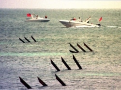 FILE - Taiwan coast guard boats patrol along the coast of Pratas Islands, January 27, 2000.
