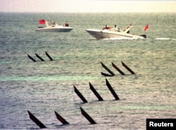 FILE - Taiwan coast guard boats patrol along the coast of Pratas Islands, January 27, 2000.