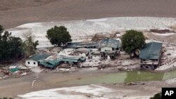 Damaged houses by River Ganges in Guptkashi, India, June 23, 2013.