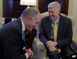 Sen. Bob Casey, Jr., D-Pa., left, shares a laugh with Supreme Court Justice nominee Neil Gorsuch at the beginning of their meeting on Capitol Hill, Feb. 16, 2017.