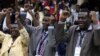 Delegates celebrate after Zimbabwean President Robert Mugabe was dismissed as party leader at an extraordinary meeting of the ruling ZANU-PF's central committee in Harare, Zimbabwe, Nov. 19, 2017.