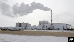 FILE - Steam blows over the Green Plains ethanol plant in Shenandoah, Iowa, Jan. 6, 2015. Without new markets, U.S. producers may have to pare output after spending hundreds of millions of dollars on biofuel production plants in recent years. 