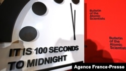 FILE - The Doomsday Clock, seen at the National Press Club in Washington, Jan. 23, 2020, reads 100 seconds to midnight. It remains unchanged for 2022.