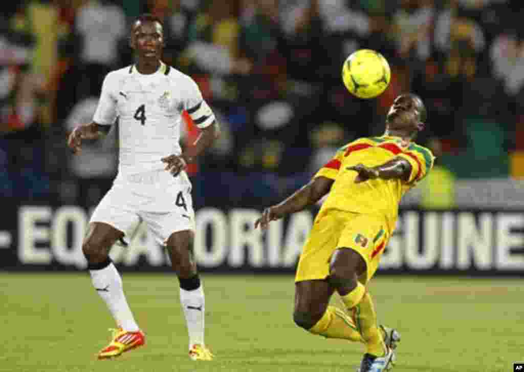 Mali's Berthe Osman (R) challenges Pantsil John (L)of Ghana during their African Cup of Nations Group D soccer match in FranceVille Stadium January 28, 2012.