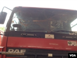 A nonoperational firetruck with a shattered window sits idle at the main fire station in Freetown, Sierra Leone, Jan. 25, 2016 (N. deVries/VOA)