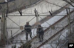 South Korean army soldiers close a gate in Paju, near the border with North Korea, Feb. 8, 2016. The U.N. Security Council condemned North Korea's launch of a long-range rocket Feb. 7, 2016, but U.S. lawmakers are skeptical. “The international community has got to apply more pressure on the North," said one U.S. official Feb. 9.
