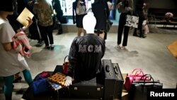 Products of MCM are displayed during an opening ceremony for a MCM flagship store in Seoul, South Korea, April 21, 2016. 