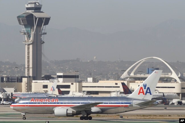 FILE - An American Airlines Boeing 767 waits to take off at Los Angeles International Airport.