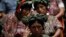 FILE - Indigenous women from the Ixil region attend a genocide trial in Guatemala City, May 9, 2013, for former Guatemalan president Efrain Rios Montt, who was accused of overseeing the killings of nearly 2,000 members of the Maya Ixil population during the country’s civil war.