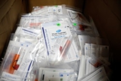 FILE - Trial kits for Pfizer's COVID-19 vaccination study are seen at the Research Centers of America, in Hollywood, Florida, Sept. 24, 2020.