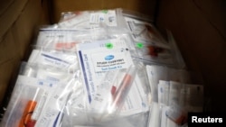 FILE - Trial kits for Pfizer's COVID-19 vaccination study are seen at the Research Centers of America, in Hollywood, Florida, Sept. 24, 2020.