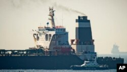 Royal Marine patrol vessel is seen beside the Grace 1 super tanker in the British territory of Gibraltar, July 4, 2019. 