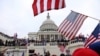 FILE - Supporters of President Donald Trump gather outside the U.S. Capitol in Washington, D.C., Jan. 6, 2021.