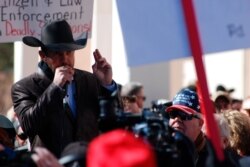 FILE - Otero County Commissioner Couy Griffin speaks, Jan. 31, 2020, in Santa Fe, N.M., as hundreds of advocates for gun rights rallied at the New Mexico Statehouse against a proposed red-flag gun law.