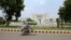 A man rides a bicycle past the Supreme Court building in Islamabad, Pakistan, June 27, 2016. 