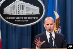FILE - Acting U.S. Attorney Michael Sherwin speaks during a news conference, Jan. 12, 2021, in Washington.