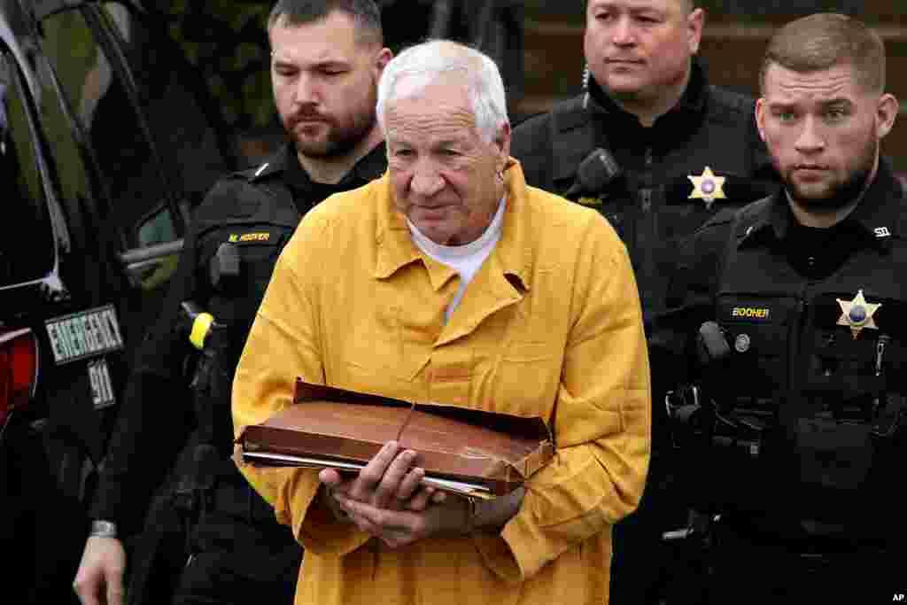 Former Penn State University assistant football coach Jerry Sandusky, center, arrives at the Centre County Courthouse in Bellefonte, Pennsylvania, to be resentenced. Sandusky was convicted of 45 counts of child sexual abuse in 2012.