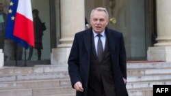 FILE - Then-French Prime Minister Jean-Marc Ayrault leaves the Elysee presidential Palace in Paris, Jan. 10, 2013. 