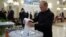 FILE - Russian President Vladimir Putin casts a ballot at a polling station during a parliamentary election in Moscow, Sept. 18, 2016.