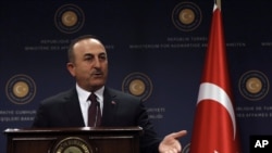 FILE - Turkey's Foreign Minister Mevlut Cavusoglu speaks during a news conference in Ankara, Turkey, Oct. 25, 2019. 