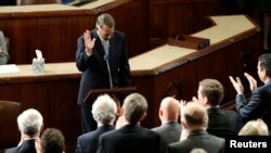 FILE - Outgoing House Speaker John Boehner departs the podium during a standing ovation after he addressed colleagues during the election for the new Speaker of the U.S. House of Representatives in the House Chamber in Washington, Oct. 29, 2015. 