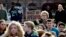 Students look on during a walkout from classes to protest the election of Donald Trump as president, Nov. 14, 2016, in Seattle, Washington. 