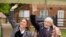 Former British Army Officer Captain Tom Moore and his daughter Hannah wave to a spitfire and hurricane from RAF Coningsby that fly over his house in Bedfordshire, Britain, April 30, 2020. (Emma Sohl/Capture the Light Photography/Handout)