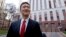 Hawaii Attorney General Doug Chin speaks with reporters in front of a federal courthouse after appearing there Dec. 6, 2017, in Seattle.