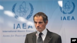 Director General of International Atomic Energy Agency, IAEA, Rafael Mariano Grossi from Argentina, addresses the media during a news conference behind plexiglass shields regarding the agency's monitoring of Irans's nuclear energy program at the…