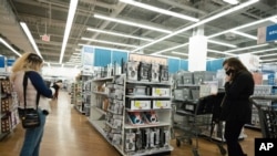 FILE - In this March 25, 2021 file photo, shoppers look at items in Bed, Bath and Beyond, in New York. U.S. consumer prices increased a sharp 0.6% in March, the biggest increase since 2012, while inflation over the past year rose a sizable 2.6%. The big…