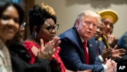 FILE - U.S. President Donald Trump listens to African American leaders during a meeting in the White House on Feb. 27, 2020, in Washington. Trump issued a declaration on Jan. 31, 2025, marking February as Black History Month.