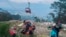 Rescue and emergency workers attend to passengers of a cable car outside Antalya, Turkey, on April 12, 2024. One person was killed and 10 injured when a cable car hit a pole and burst open, sending the passengers plummeting to the mountainside below, officials said.