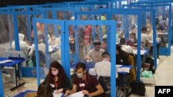 Electoral workers count ballots in Israel's general elections in Jerusalem, March 25, 2021.