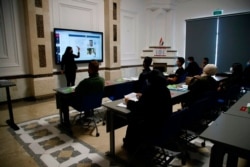 Students of the newly inaugurated American University in Baghdad study in the classroom in Baghdad, Iraq, Feb. 15, 2021.