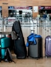 Passengers' luggage is on the floor at the Berlin-Brandenburg airport, during the airports warning strike, March 10, 2025