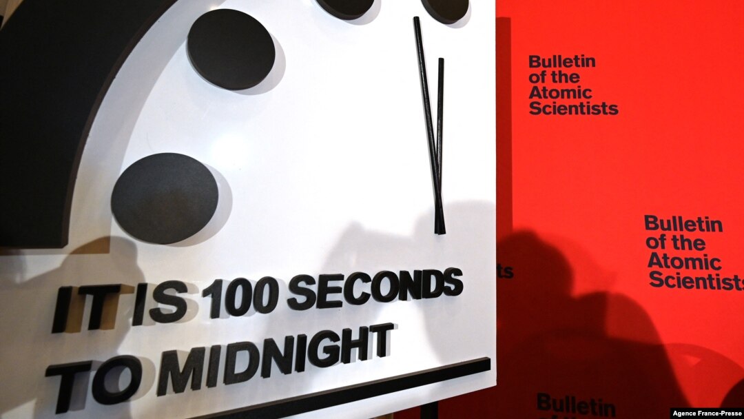 FILE - The Doomsday Clock, seen at the National Press Club in Washington, Jan. 23, 2020, reads 100 seconds to midnight. It remains unchanged for 2022.