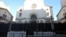 Two men walk in front of the synagogue in Marseille, southern France, Jan. 13, 2016. An attack on a man wearing a kippah has sparked debate on whether Jewish males should wear the skullcap in recognition of their faith.