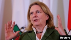 FILE - Austria's Foreign Minister Karin Kneissl addresses the media after a cabinet meeting in Vienna, Austria, April 4, 2018. 