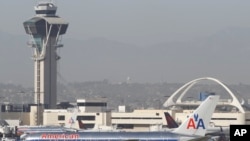 FILE - An American Airlines Boeing 767 waits to take off at Los Angeles International Airport.