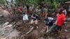 FILE - Members of the Malawian Army and locals help the community to recover bodies of victims in Chimwankhunda township in the aftermath of Tropical Cyclone Freddy in Blantyre, Malawi, March 17, 2023.