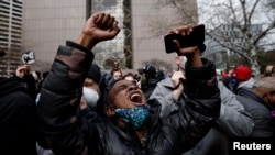 A person reacts after the verdict in the trial of former Minneapolis police officer Derek Chauvin, in the death of George Floyd, in front of Hennepin County Government Center, in Minneapolis.